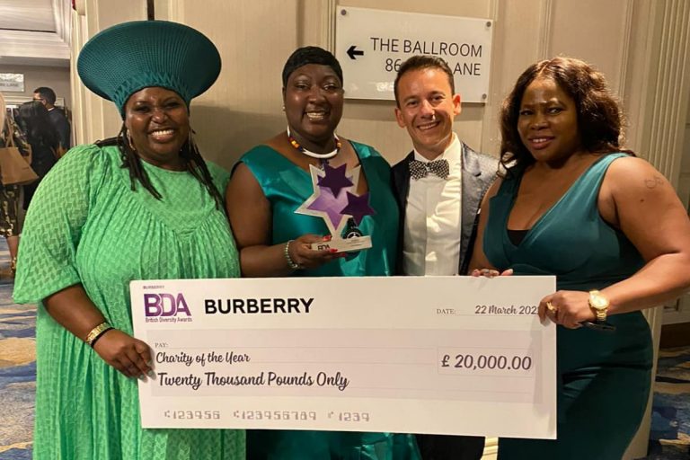 Moud Goba, Micro Rainbow patron Phyll Opoku-Gyimah, Sebastian Rocca and Nontu Maraire holding a cheque for £20K for Charity of the Year at the Burberry British Diversity Awards