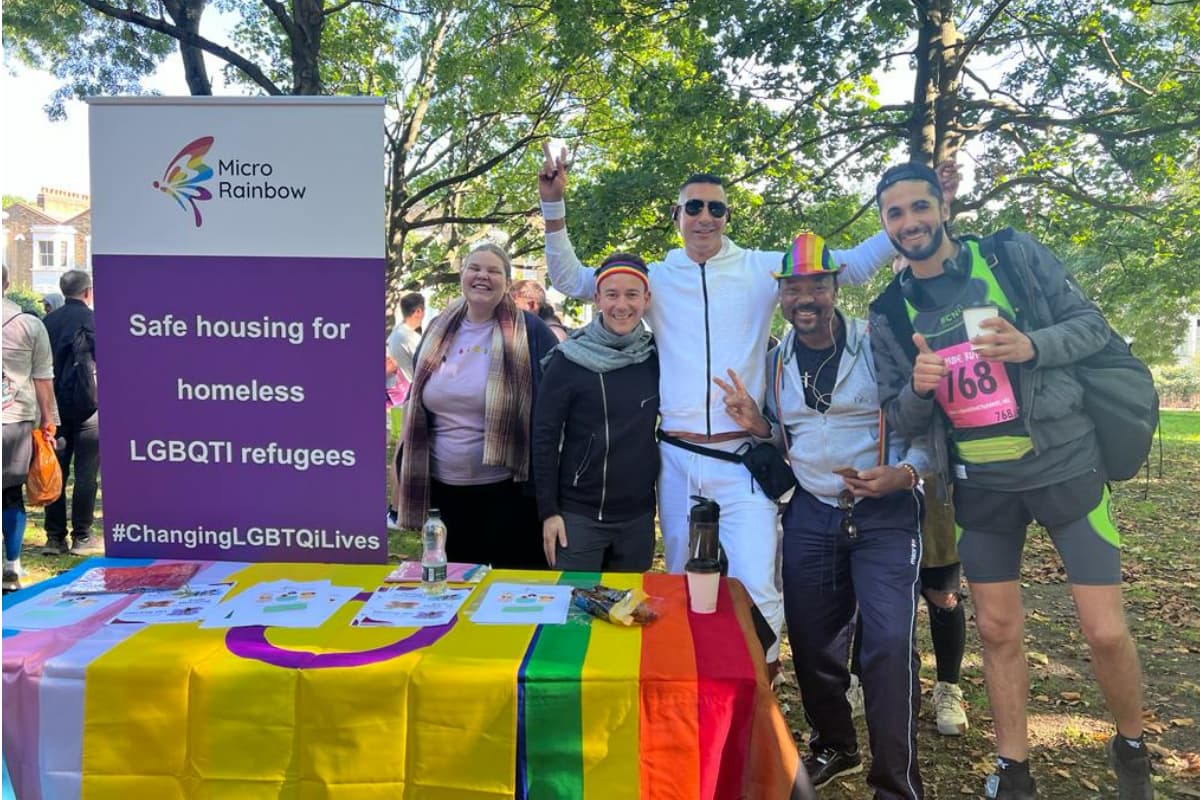 Members of the Micro Rainbow team and beneficiaries at the Micro Rainbow stall during the Pride Run 2022