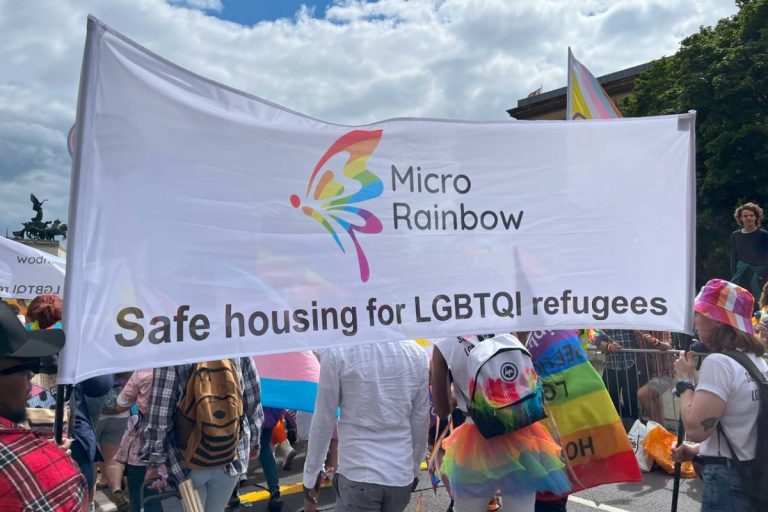 Micro Rainbow banner - Safe housing for LGBTQI refugees