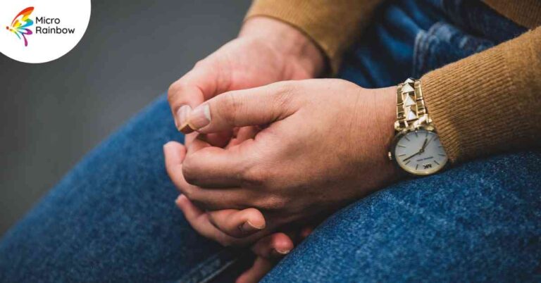 A close-up of a participant's hands at the Micro Rainbow community theatre workshop.